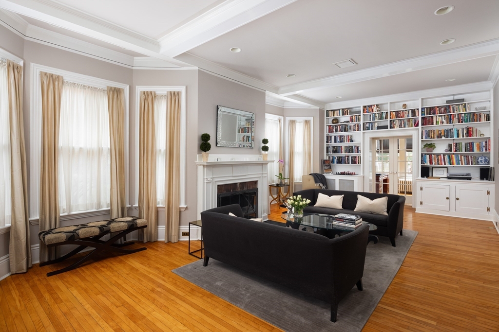 75 Clinton Place Newton, MA 02459 - Photo 7 of 18 a living room with furniture and a fireplace