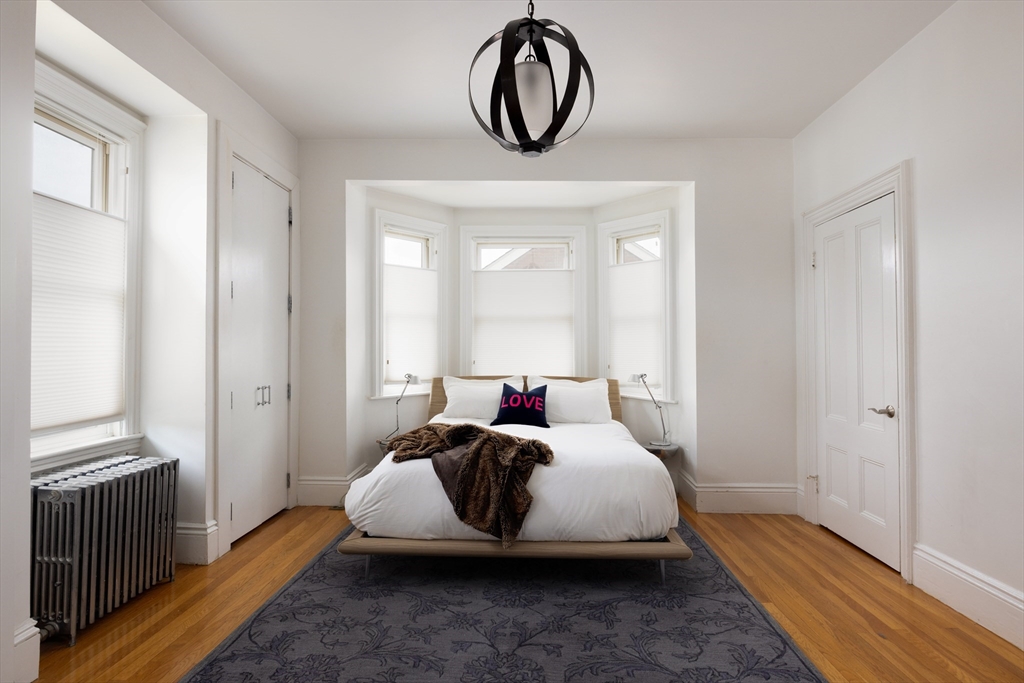 75 Clinton Place Newton, MA 02459 - Photo 10 of 18 a bedroom with bed and a window