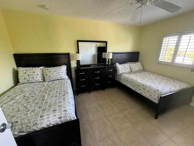a kitchen with refrigerator and stove