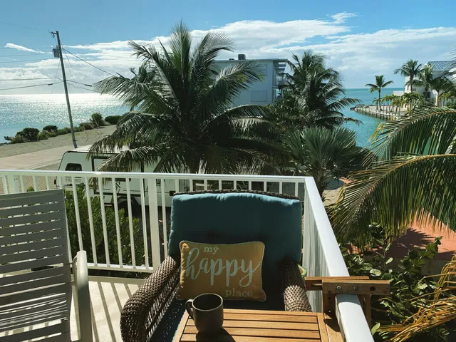 a kitchen with stainless steel appliances granite countertop a sink a refrigerator and a granite counter tops