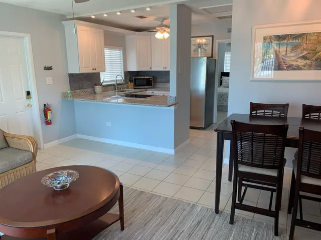 a kitchen with stainless steel appliances granite countertop a sink and a stove