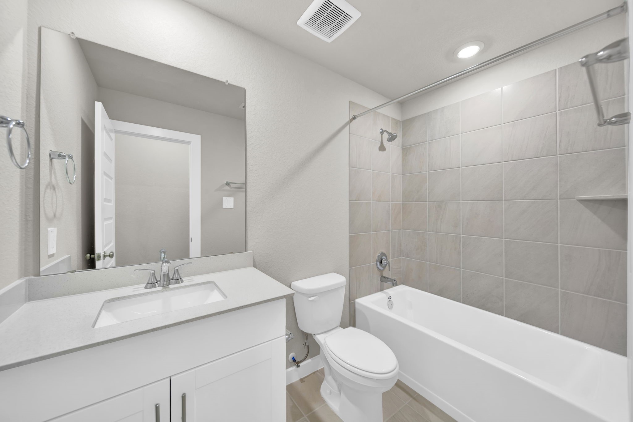 16675 Sterling Clf Street Conroe, TX 77302 - Photo 13 of 21 a bathroom with a granite countertop sink a toilet and a bathtub