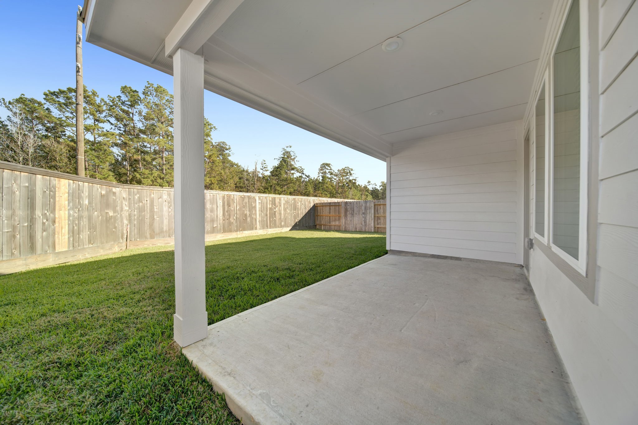 16675 Sterling Clf Street Conroe, TX 77302 - Photo 16 of 21 a view of a porch with a yard