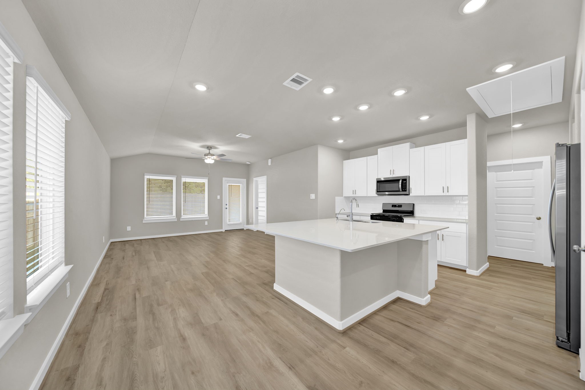 16675 Sterling Clf Street Conroe, TX 77302 - Photo 3 of 21 a view of kitchen with kitchen island sink and refrigerator