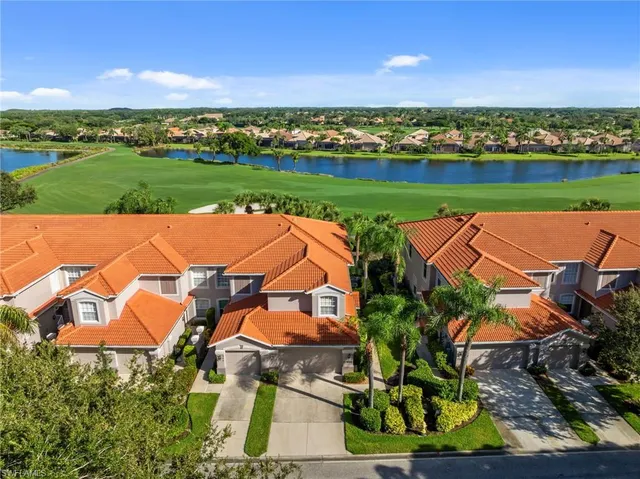an aerial view of a house with a big yard