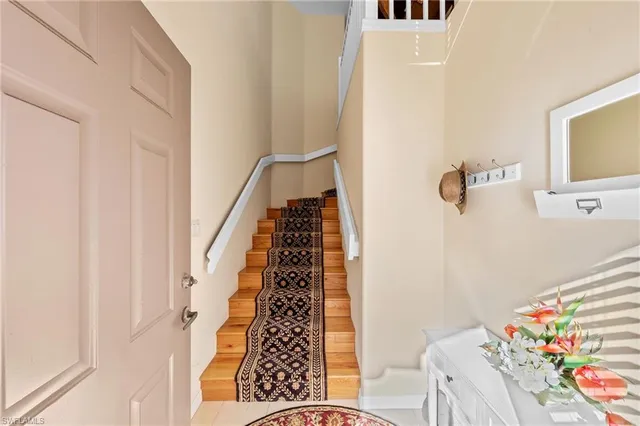 a view of a bedroom with furniture and staircase
