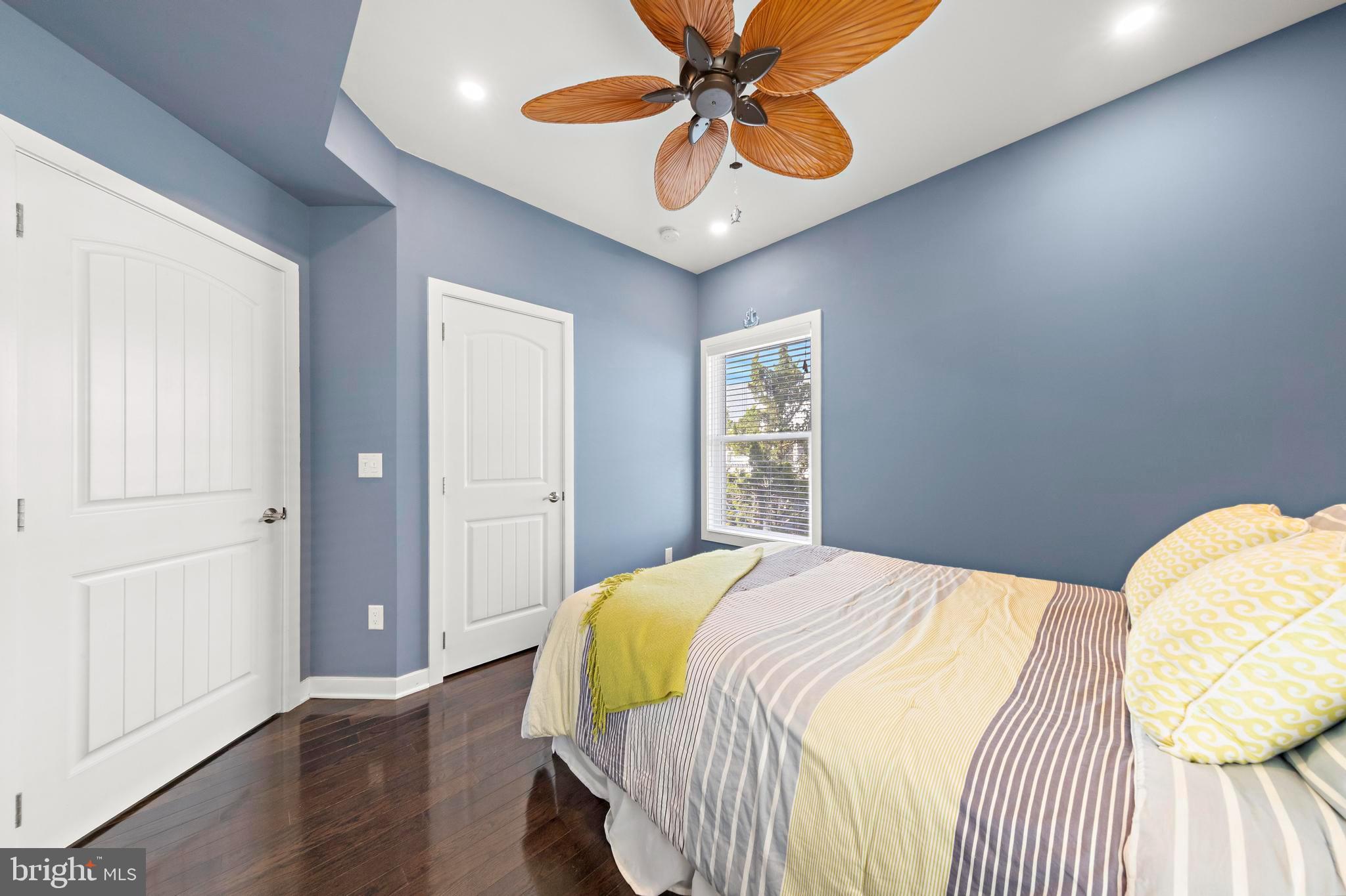 27 West 33rd Street Long Beach Township, NJ 08008 - Photo 13 of 83 a bedroom with a bed and wooden floor