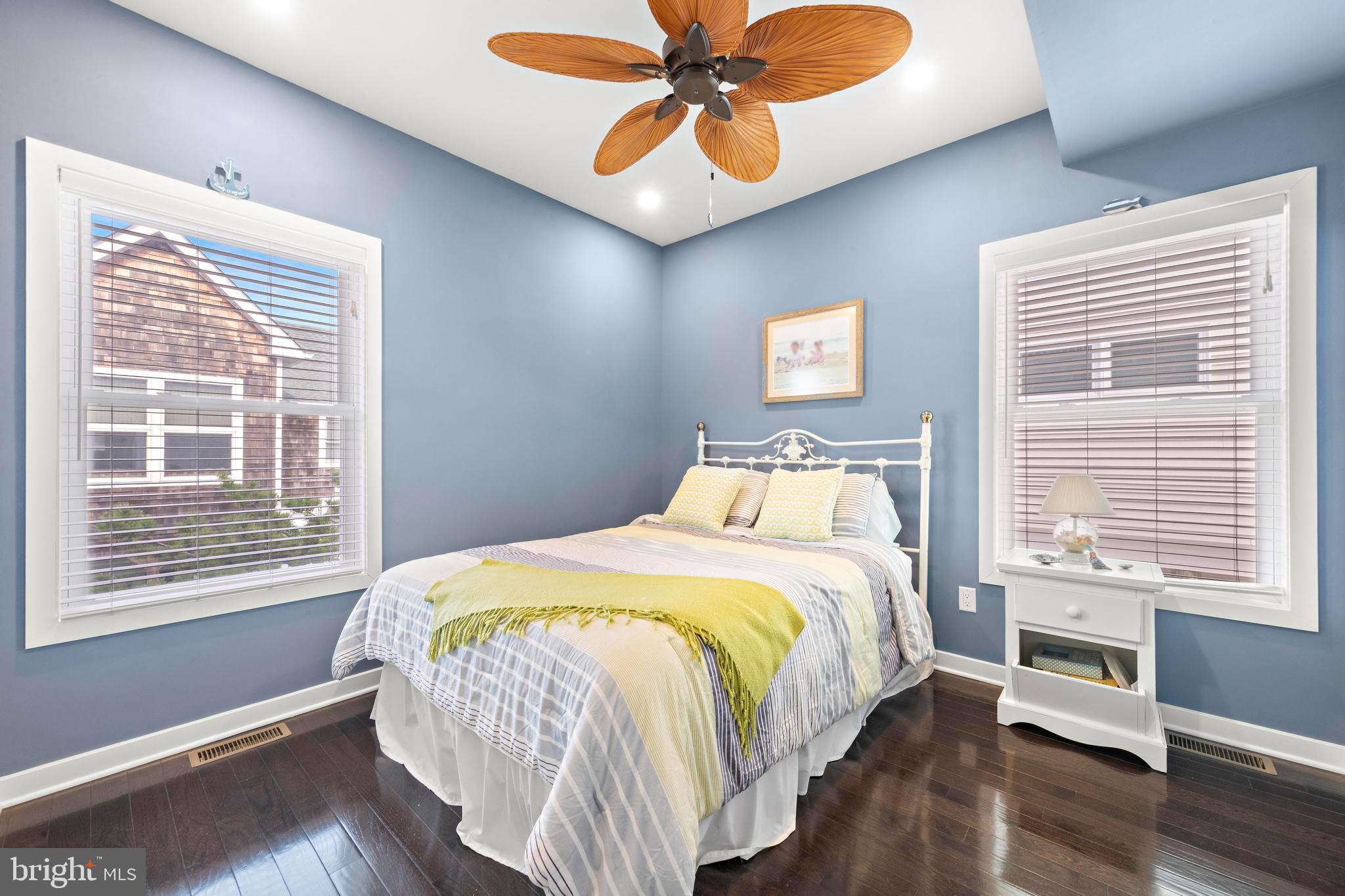 27 West 33rd Street Long Beach Township, NJ 08008 - Photo 14 of 83 a bedroom with a bed and wooden floor