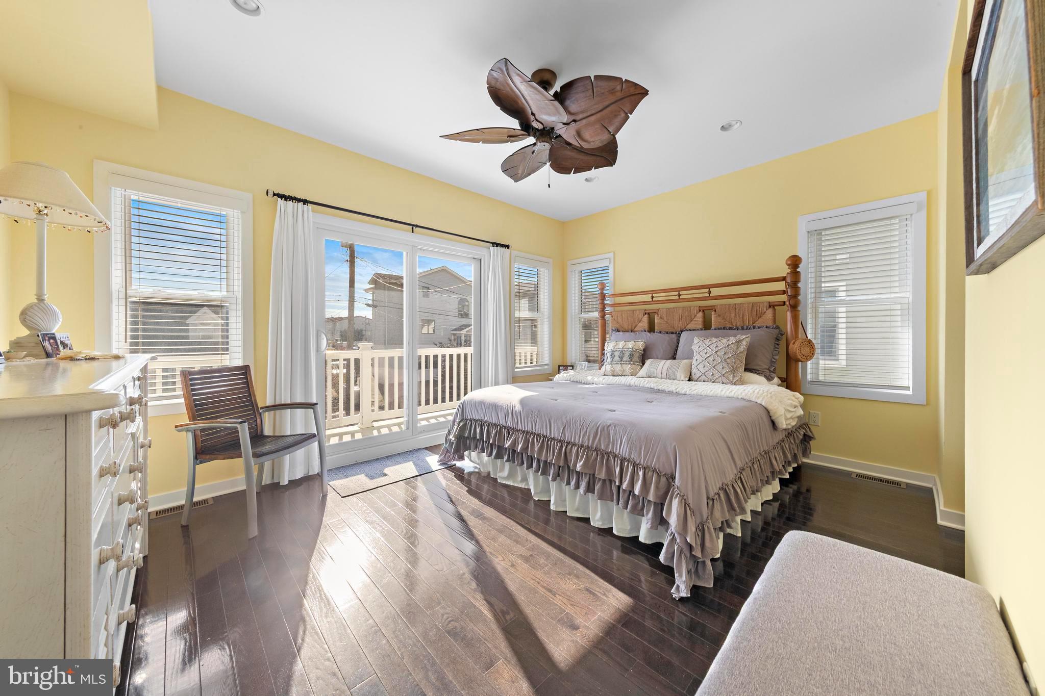 27 West 33rd Street Long Beach Township, NJ 08008 - Photo 15 of 83 a spacious bedroom with a large bed and a large window