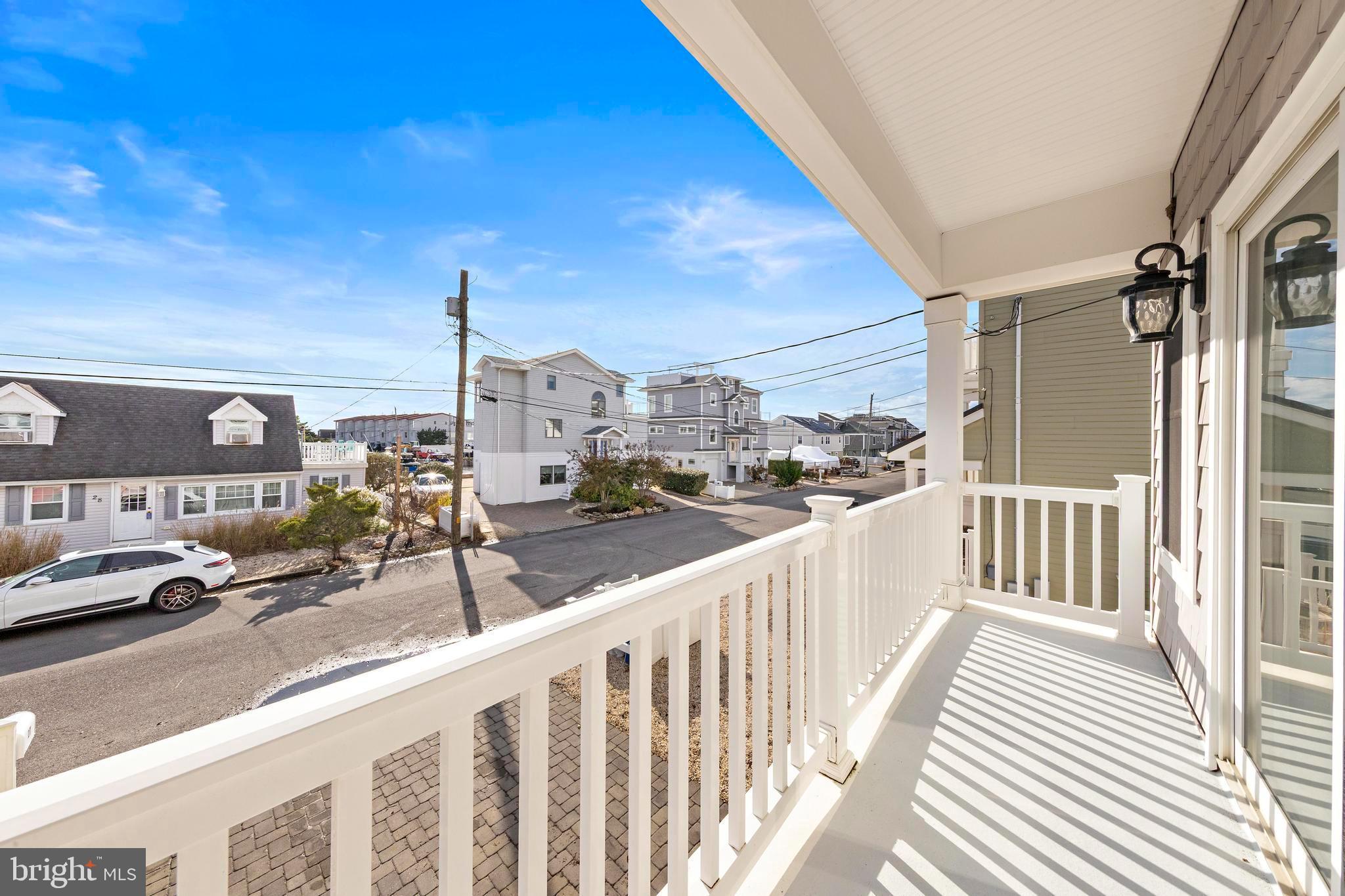 27 West 33rd Street Long Beach Township, NJ 08008 - Photo 19 of 83 a view of a balcony with car parked