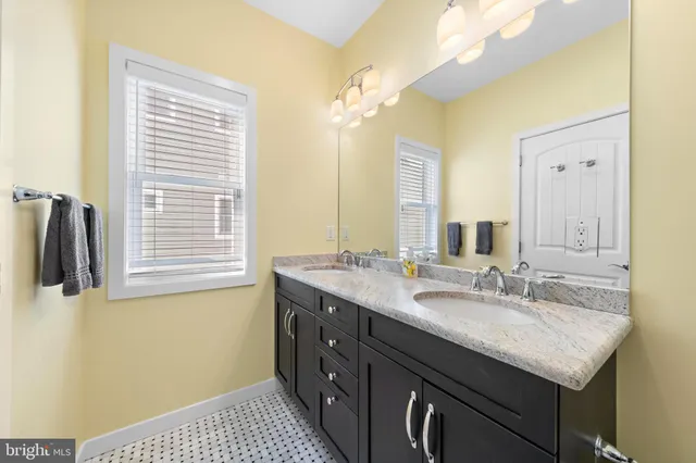 a kitchen with a dining table chairs appliances and cabinets