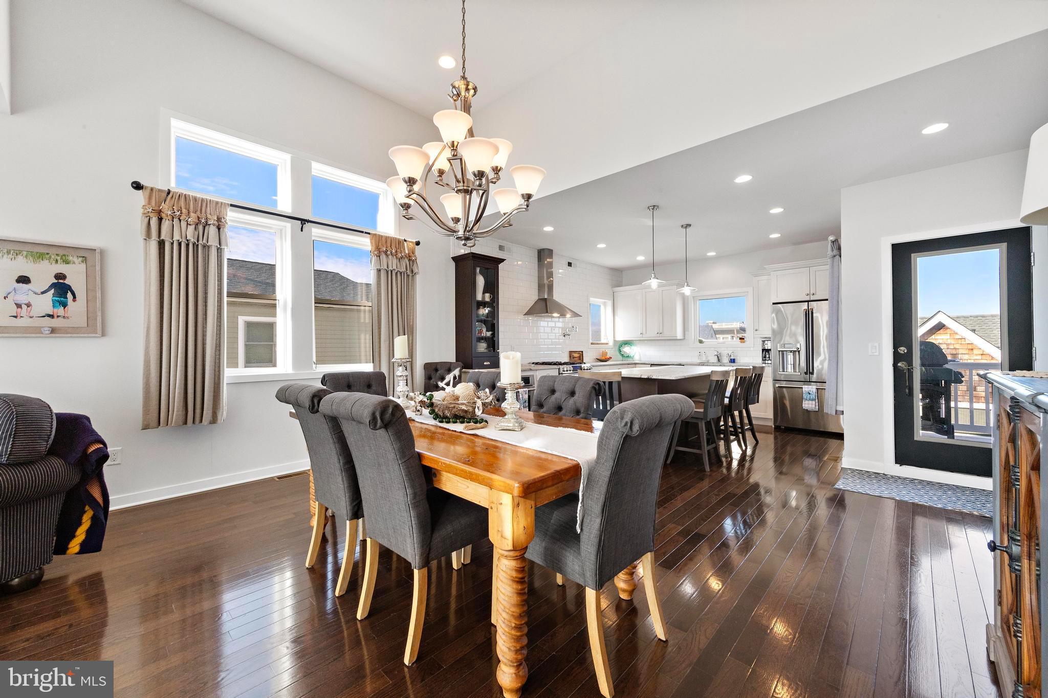 27 West 33rd Street Long Beach Township, NJ 08008 - Photo 27 of 83 a view of a dining room with furniture and wooden floor