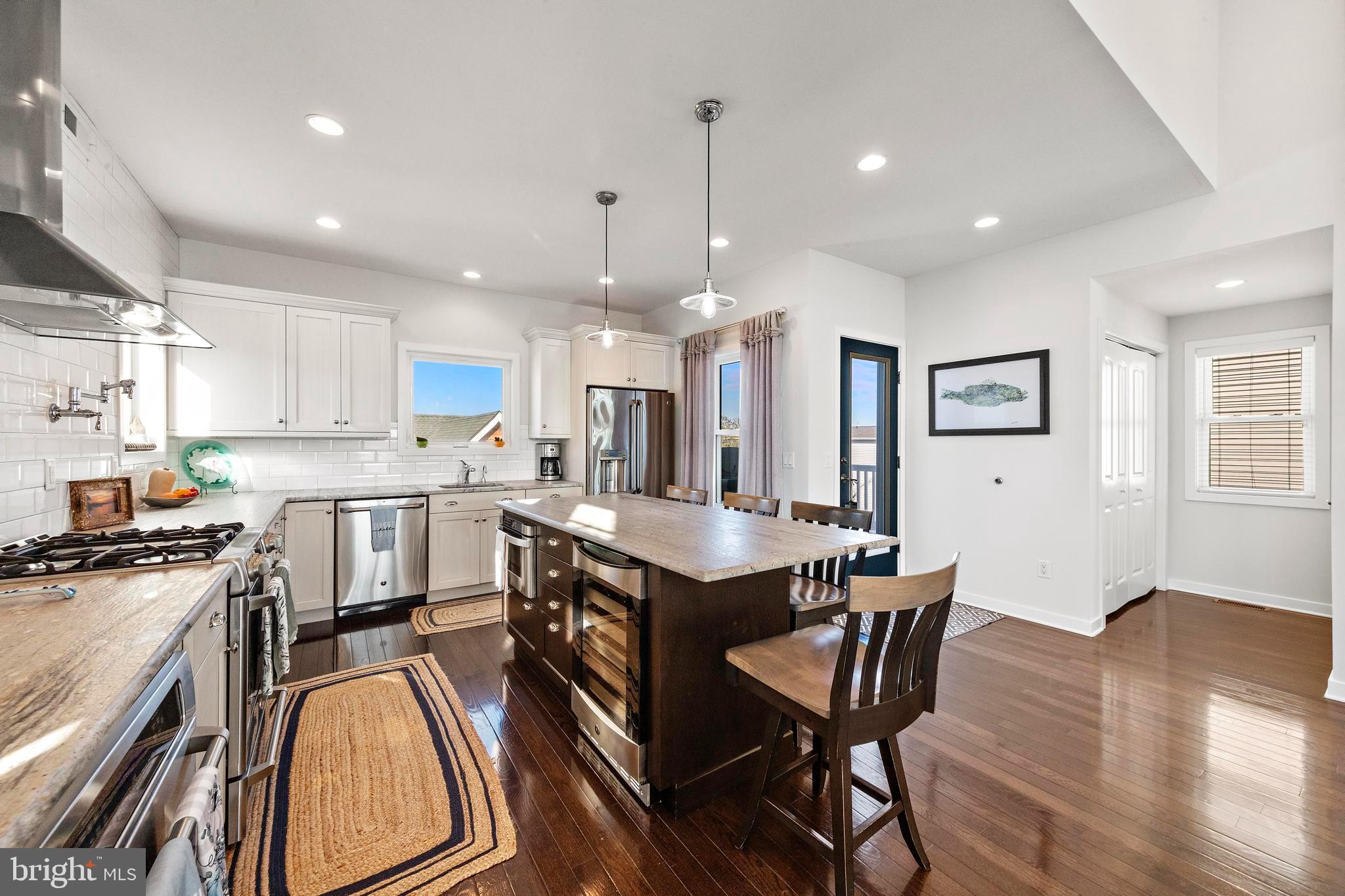 27 West 33rd Street Long Beach Township, NJ 08008 - Photo 29 of 83 a kitchen that has a lot of cabinets in it and appliances
