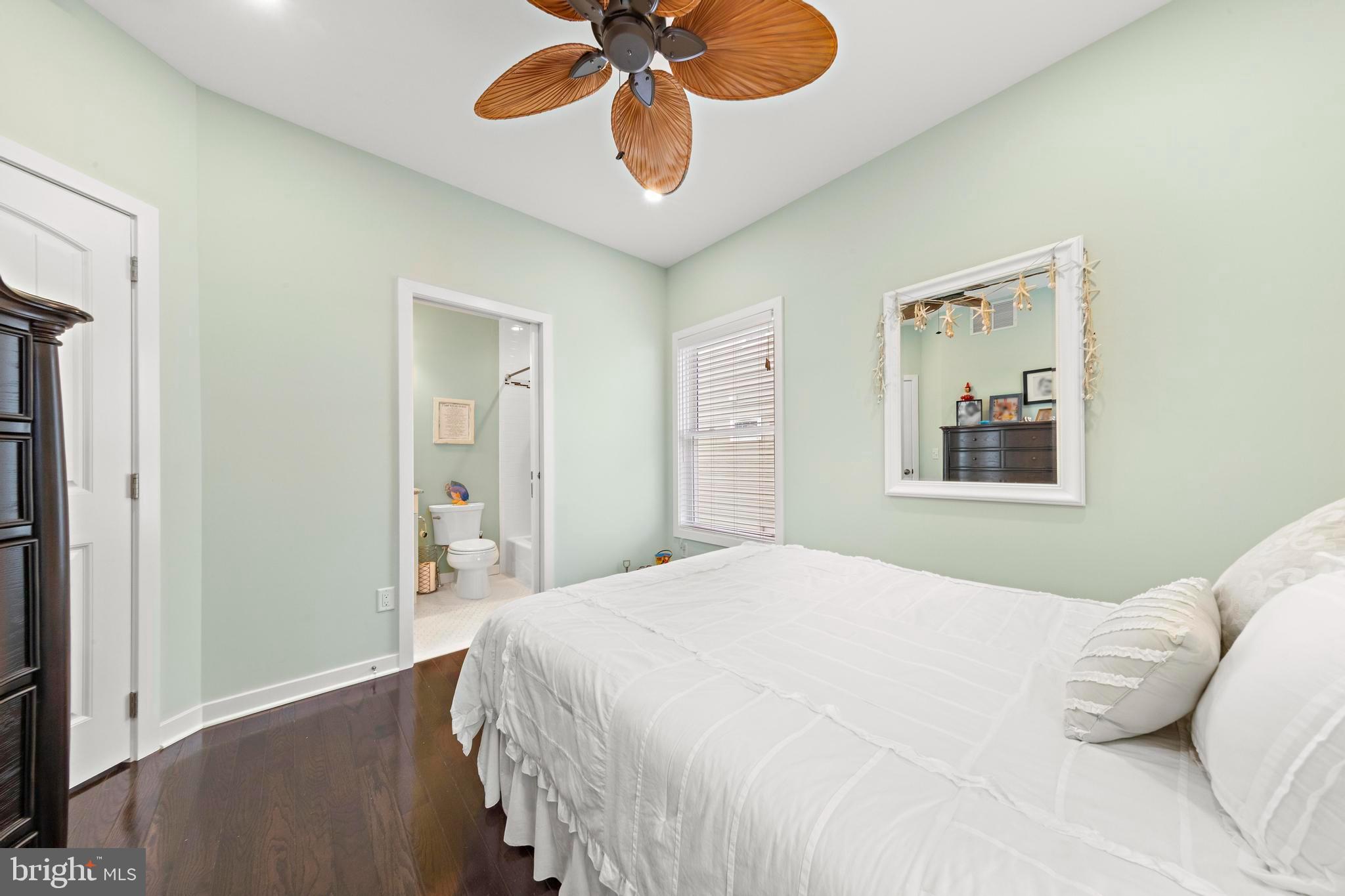 27 West 33rd Street Long Beach Township, NJ 08008 - Photo 8 of 83 a bedroom with a bed and a chandelier