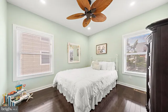 a spacious bedroom with a large bed and a large window