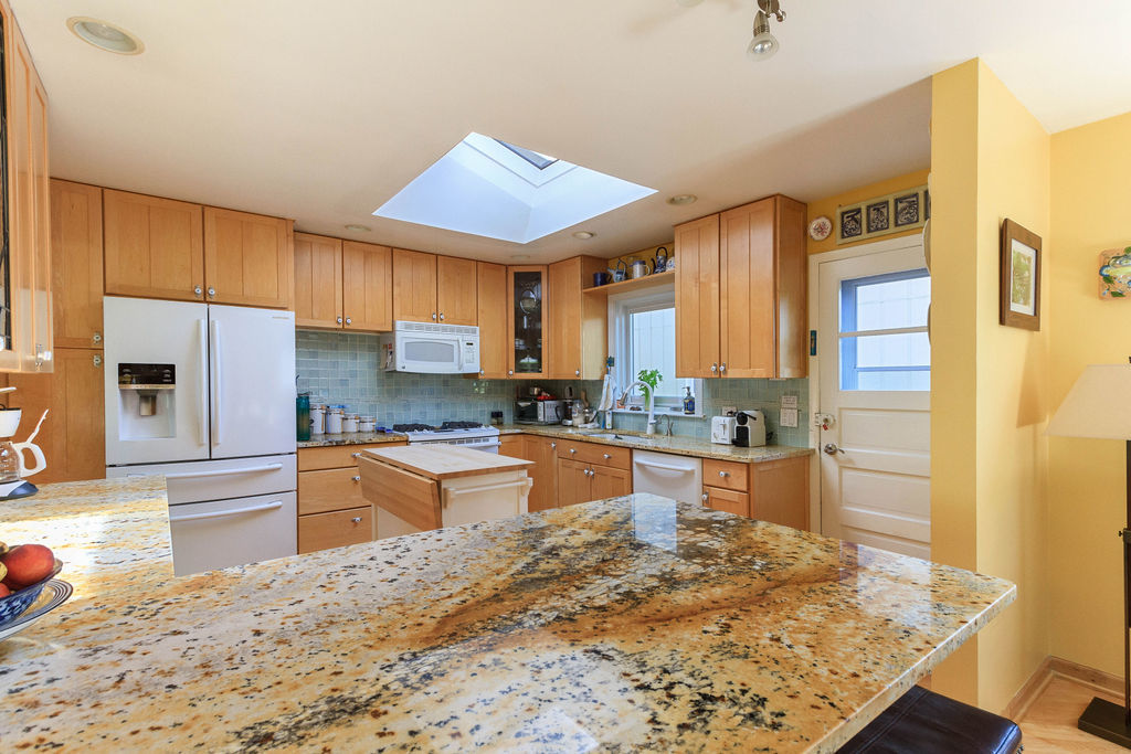 789 Ridge Road Highland Park, IL 60035 - Photo 12 of 36 a large kitchen with kitchen island sink stainless steel appliances and cabinets