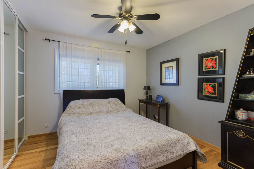 789 Ridge Road Highland Park, IL 60035 - Photo 16 of 36 a bedroom with a bed and a flat screen tv