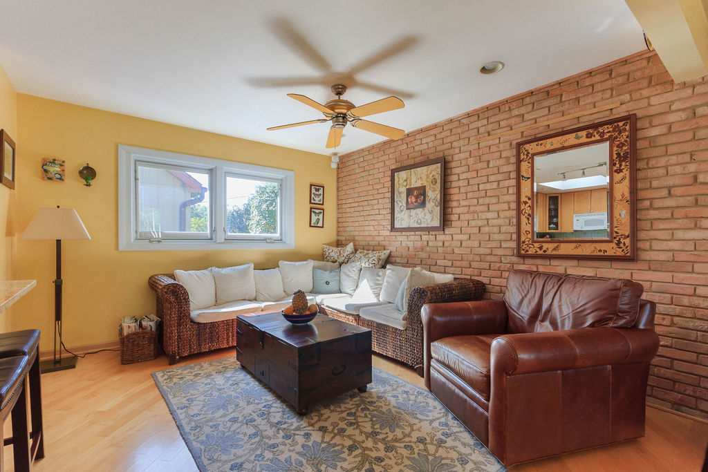 789 Ridge Road Highland Park, IL 60035 - Photo 10 of 36 a living room with furniture ceiling fan and a rug