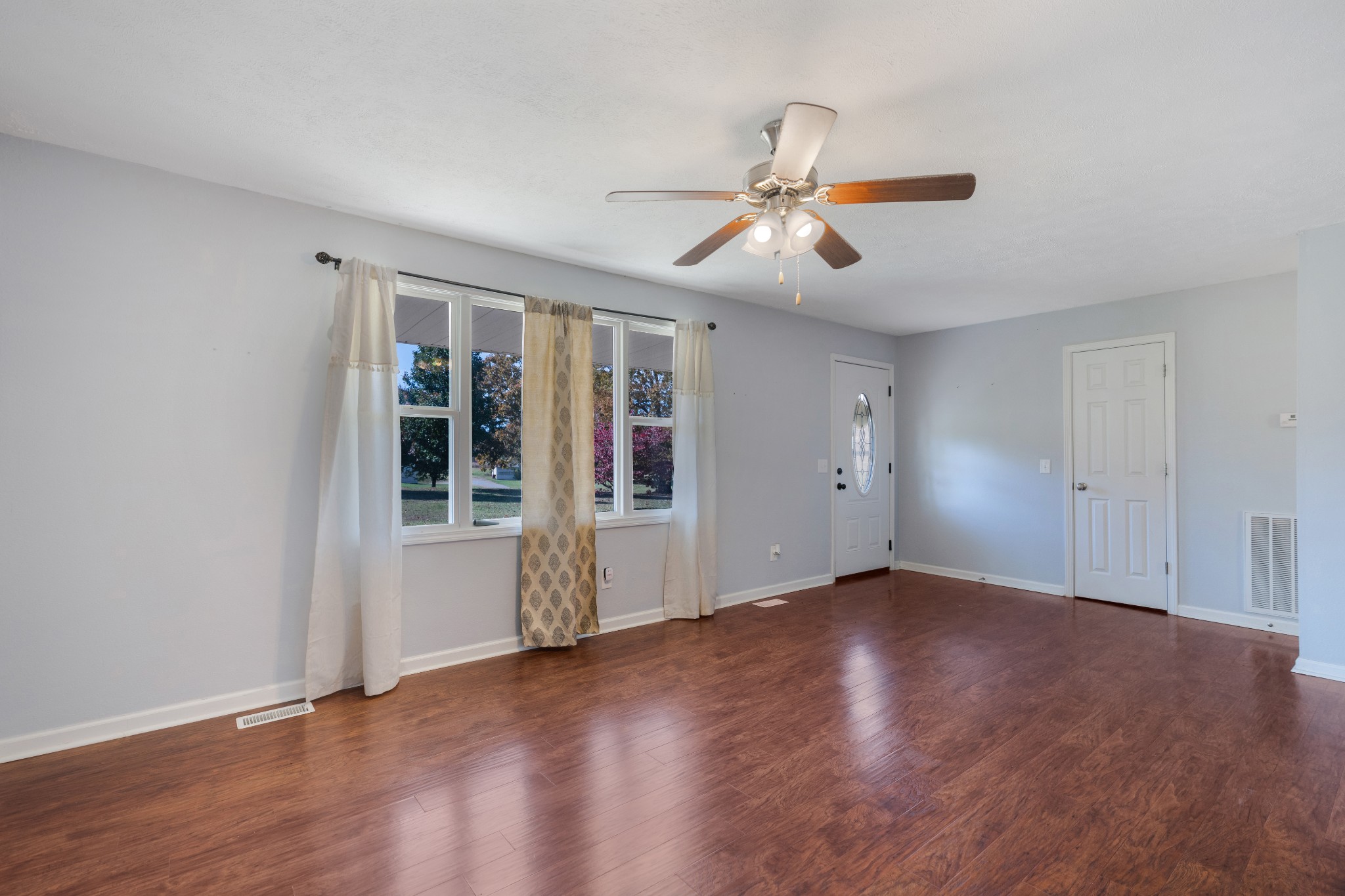 5433 Marion Road Cunningham, TN 37052 - Photo 8 of 29 a view of an empty room with wooden floor and a window