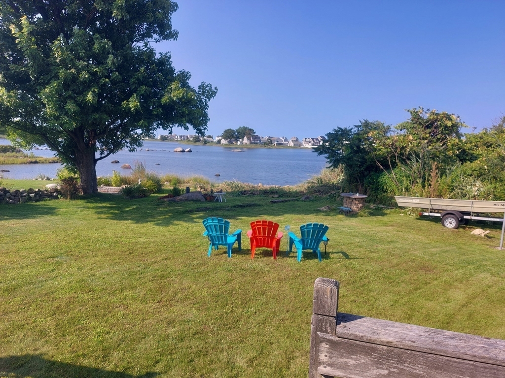 430 Hatherly Road, Unit EXHIBIT “B” Scituate, MA 02066 - Photo 6 of 18 a view of a lake with houses