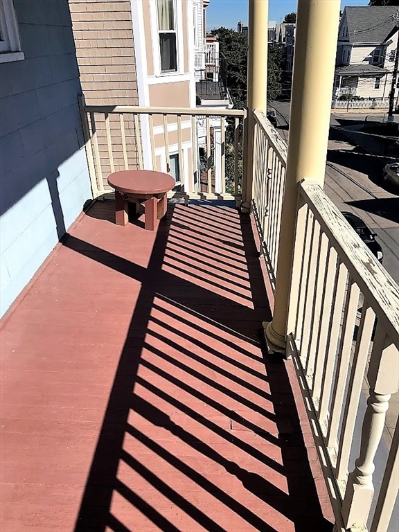 28 Litchfield Street, Unit 3 Boston, MA 02135 - Photo 11 of 11 a view of a balcony with chairs