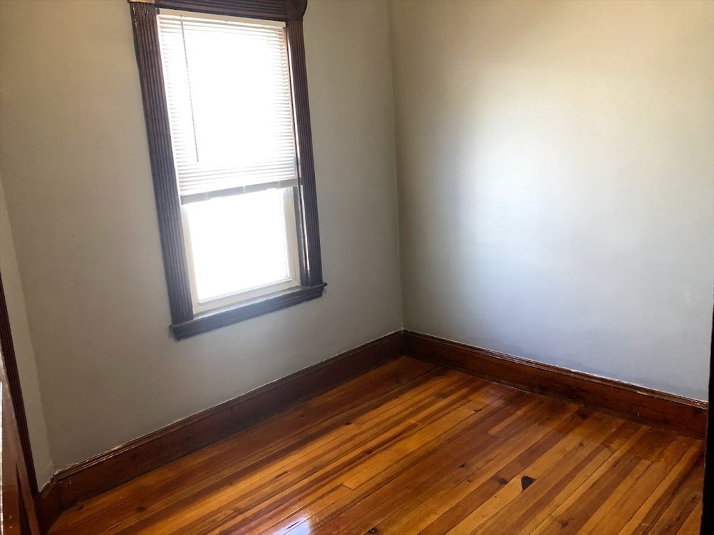 28 Litchfield Street, Unit 3 Boston, MA 02135 - Photo 2 of 11 a view of a room with wooden floor and fan