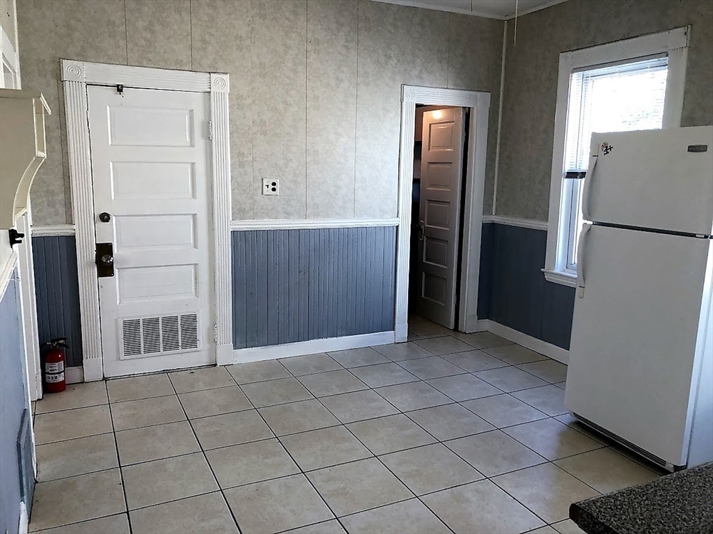 28 Litchfield Street, Unit 3 Boston, MA 02135 - Photo 6 of 11 an empty room with closet and windows