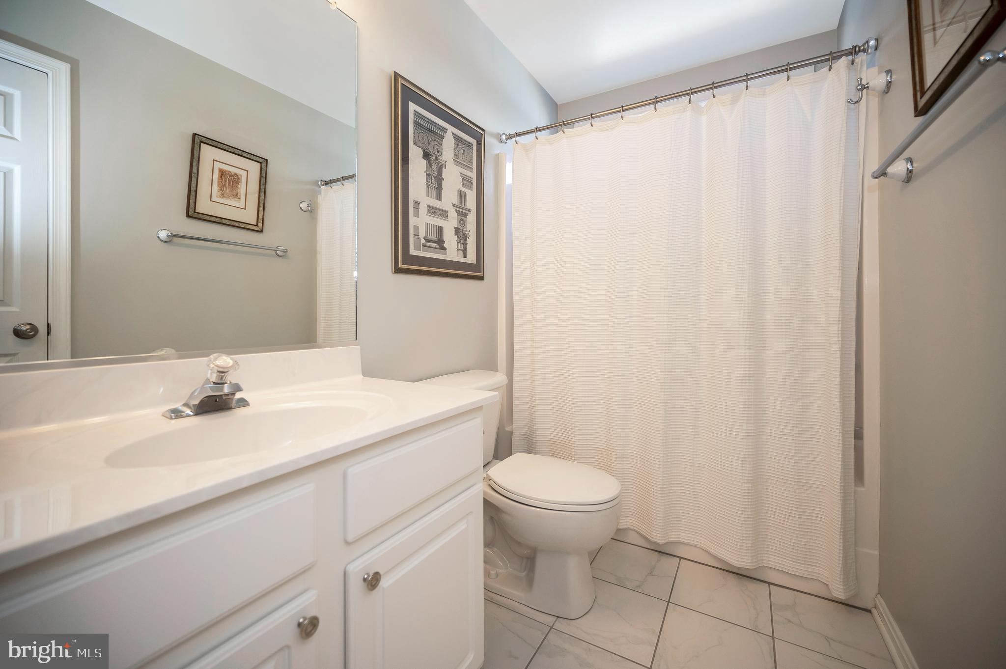 212 Birdie Road Locust Grove, VA 22508 - Photo 24 of 46 Hall bath with tub-shower combo and tile floor