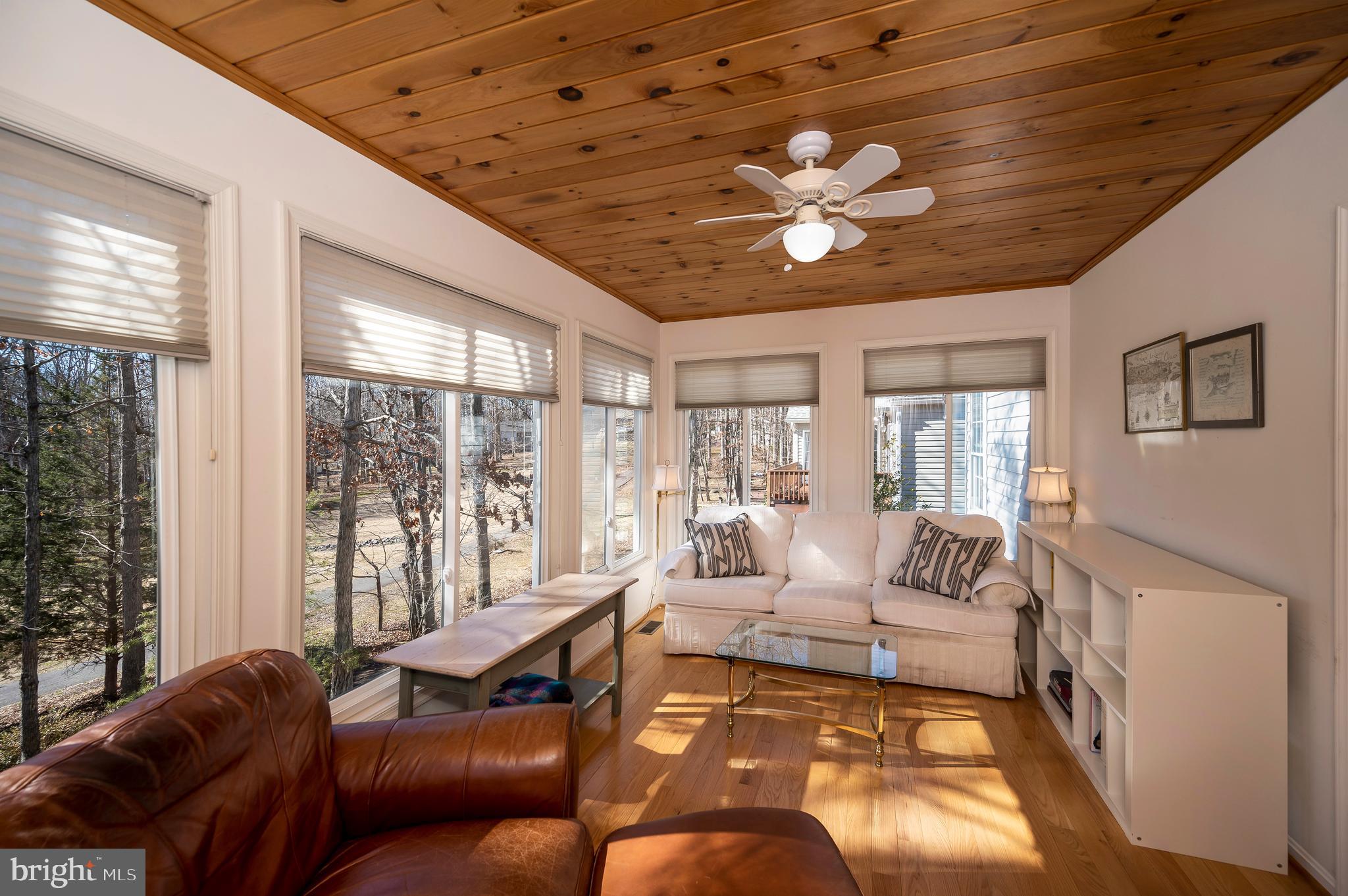 212 Birdie Road Locust Grove, VA 22508 - Photo 7 of 46 The sunroom is a cozy oasis with golf course views