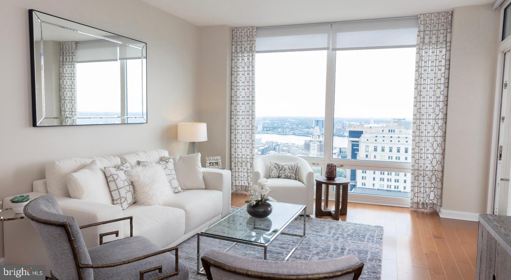 206 West Washington Square, Unit 1908 Philadelphia, PA 19106 - Photo 15 of 31 a living room with furniture and a large window
