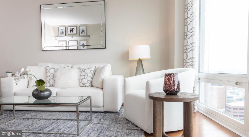 206 West Washington Square, Unit 1908 Philadelphia, PA 19106 - Photo 17 of 31 a living room with furniture and a table