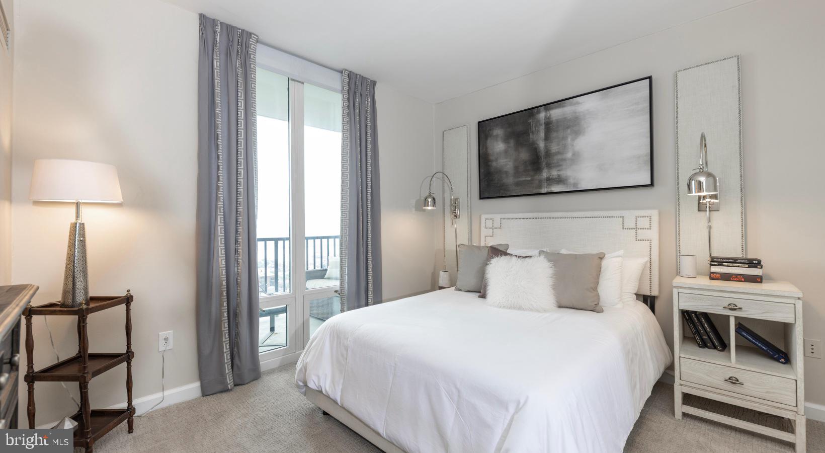 206 West Washington Square, Unit 1908 Philadelphia, PA 19106 - Photo 21 of 31 a bedroom with a bed and a flat screen tv