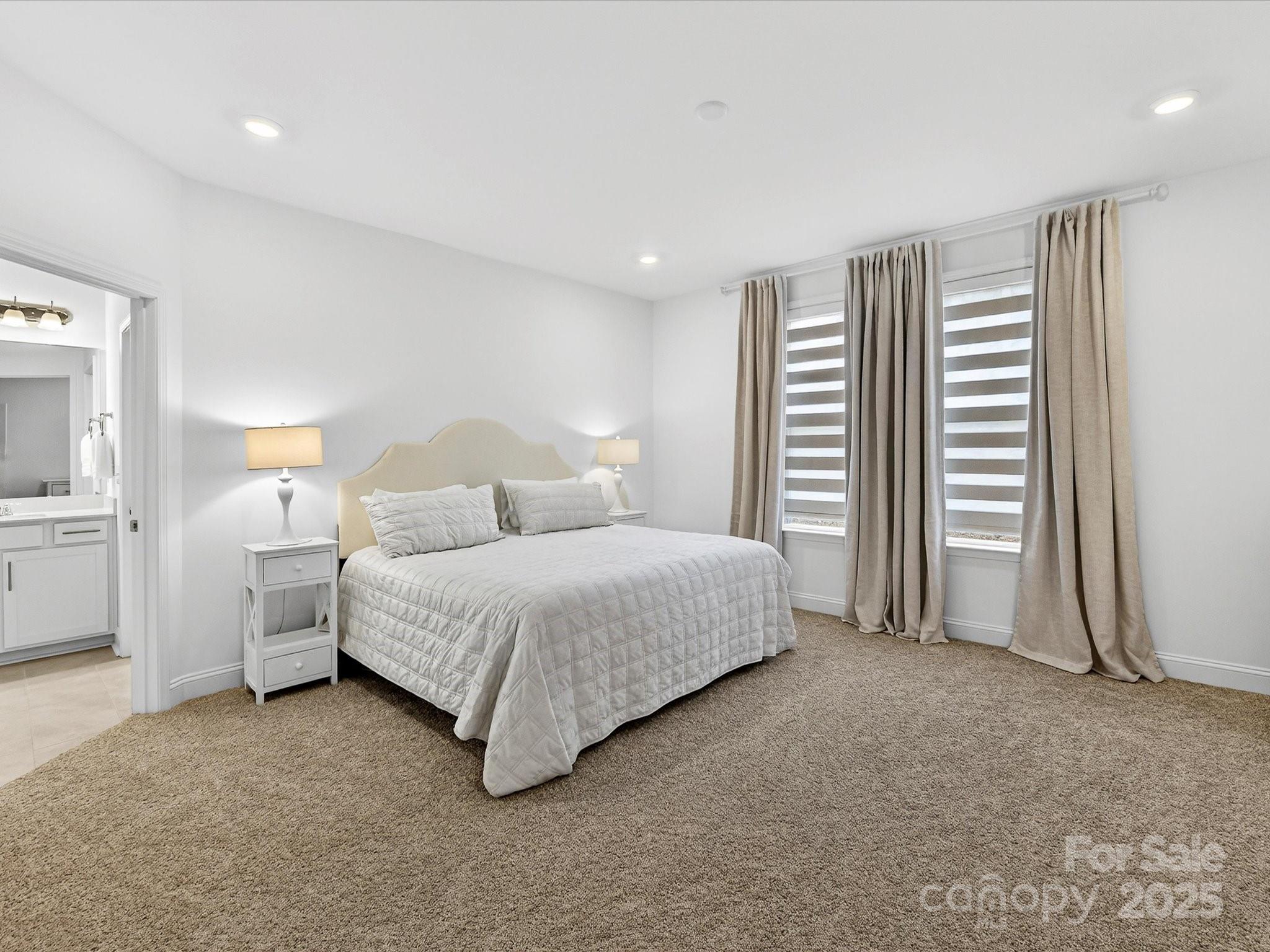 4790 Formation Court Lancaster, SC 29720 - Photo 21 of 41 a spacious bedroom with a bed and a cabinets