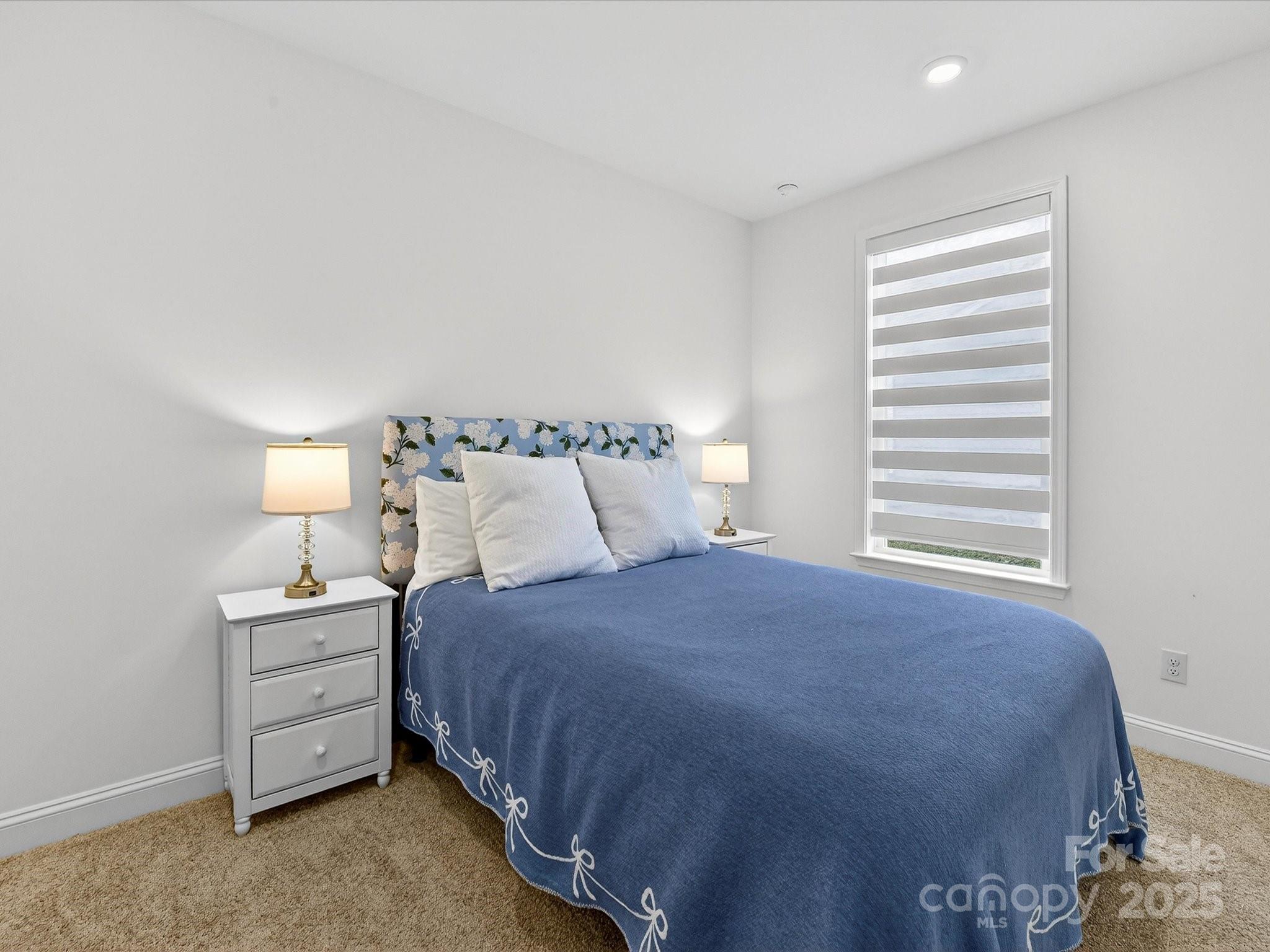 4790 Formation Court Lancaster, SC 29720 - Photo 28 of 41 a bedroom with a bed and a night stand