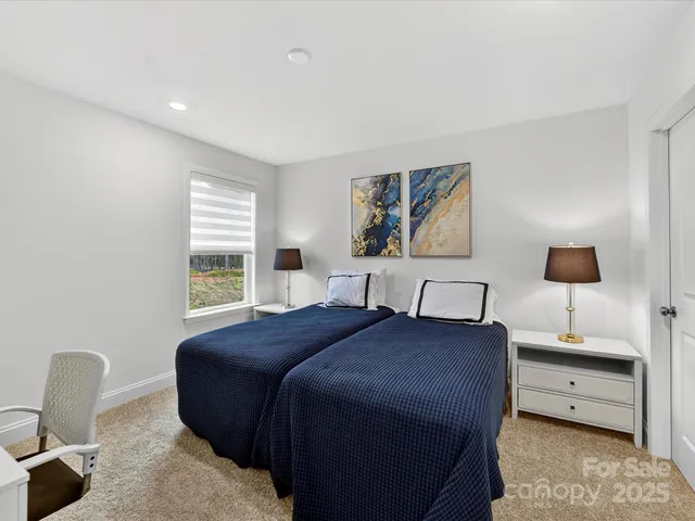 a bedroom with a bed and a chair