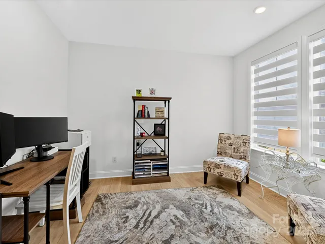 a workspace with furniture and rug