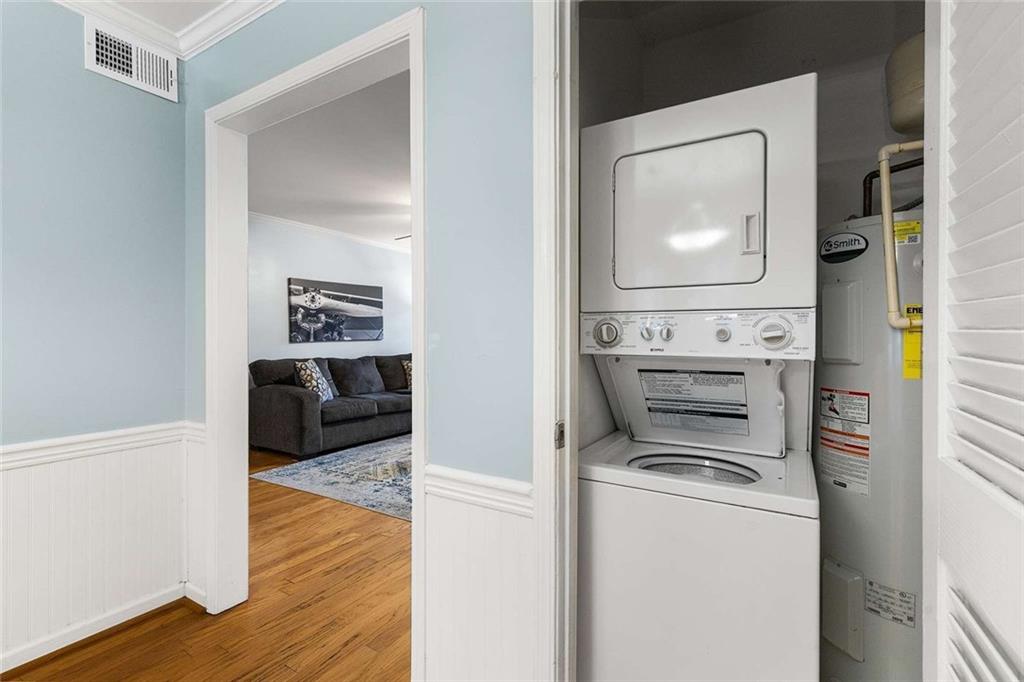 1101 Collier Road Northwest, Unit P2 Atlanta, GA 30318 - Photo 15 of 26 a view of washer and dryer with wooden floor