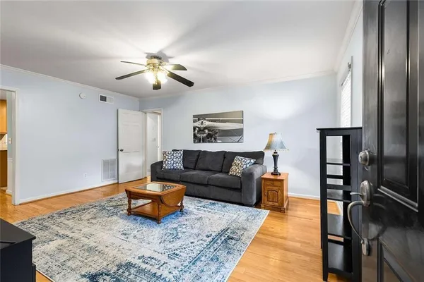 a living room with furniture and a rug