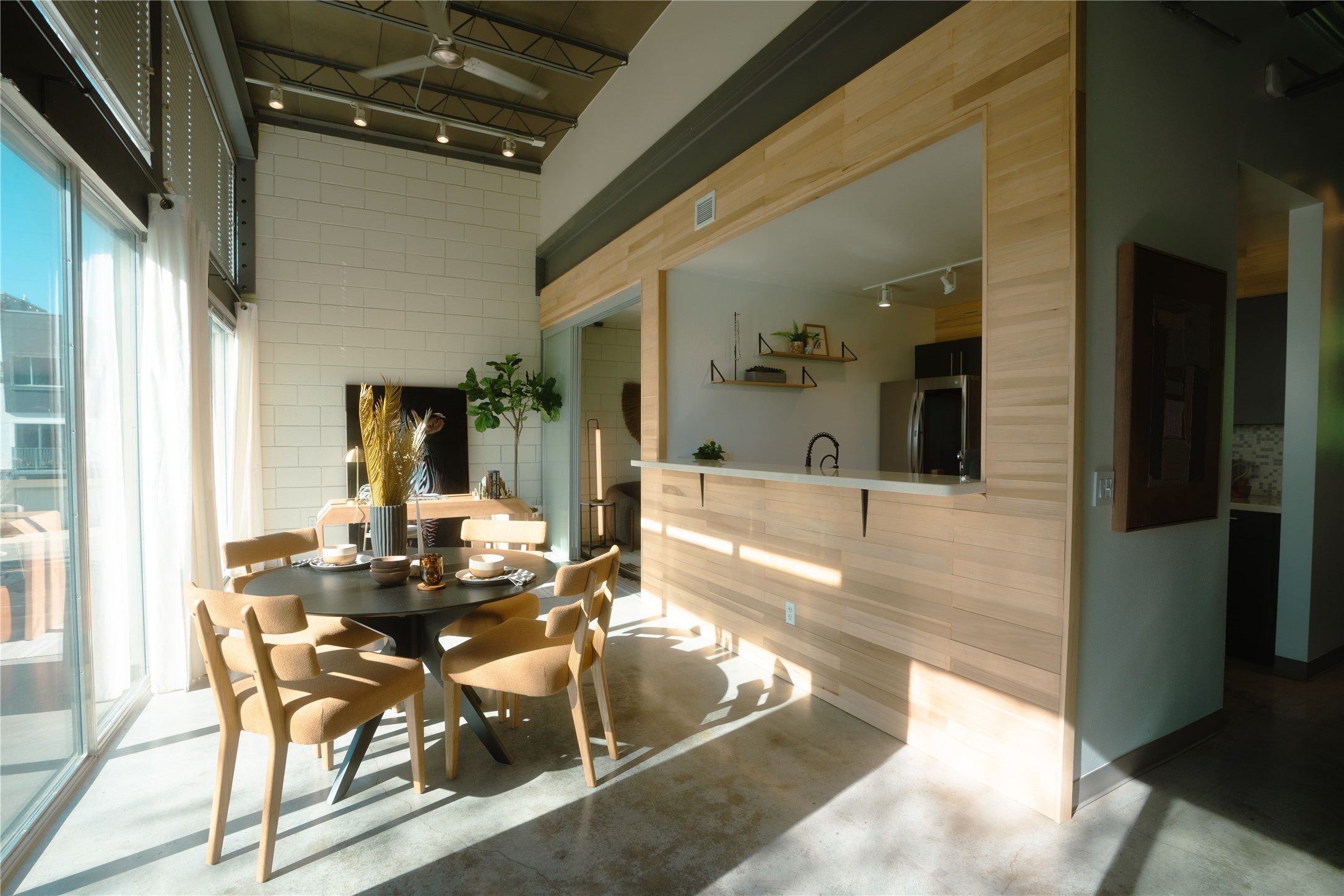4801 South Congress Avenue, Unit H5 Austin, TX 78745 - Photo 1 of 39 Dining area featuring track lighting and concrete floors
