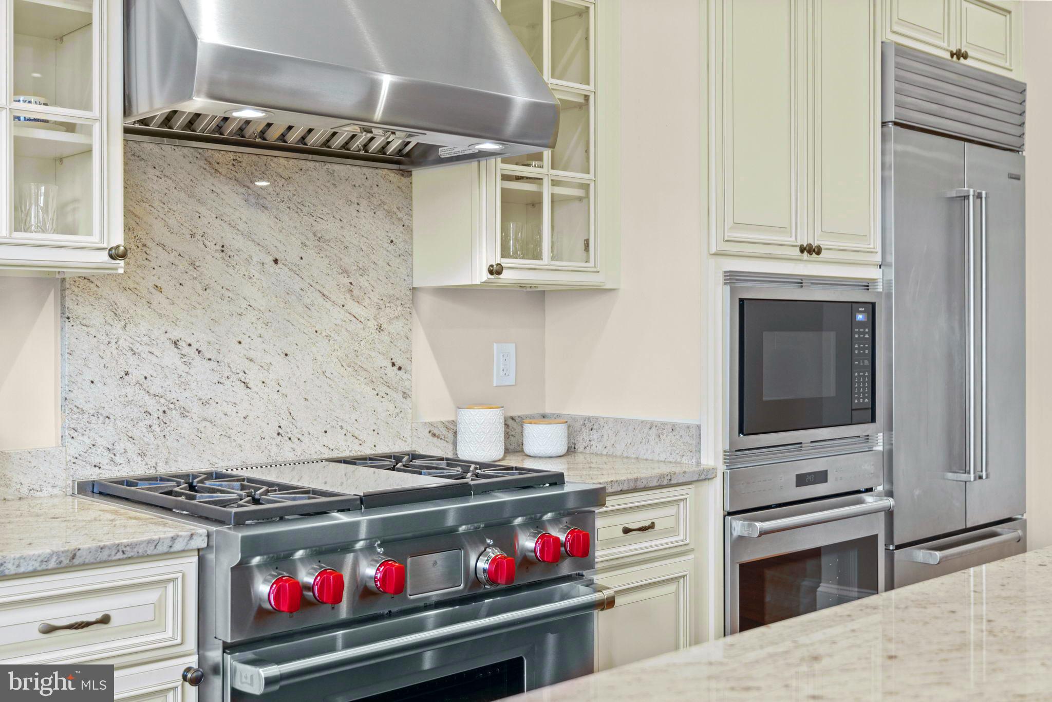 7708 Beech Tree Road Bethesda, MD 20817 - Photo 11 of 55 a kitchen with stainless steel appliances granite countertop a stove and a refrigerator