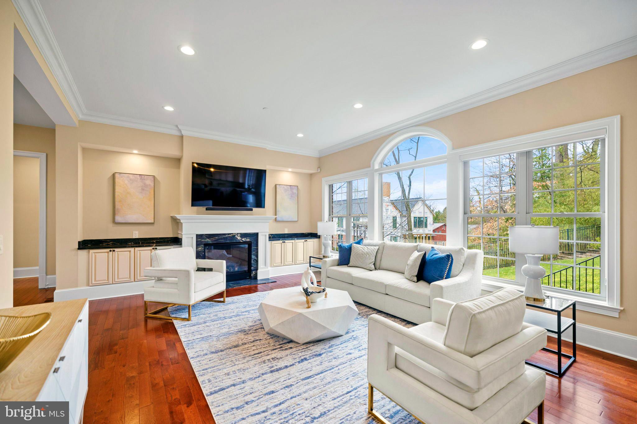 7708 Beech Tree Road Bethesda, MD 20817 - Photo 15 of 55 a living room with fireplace furniture and a flat screen tv