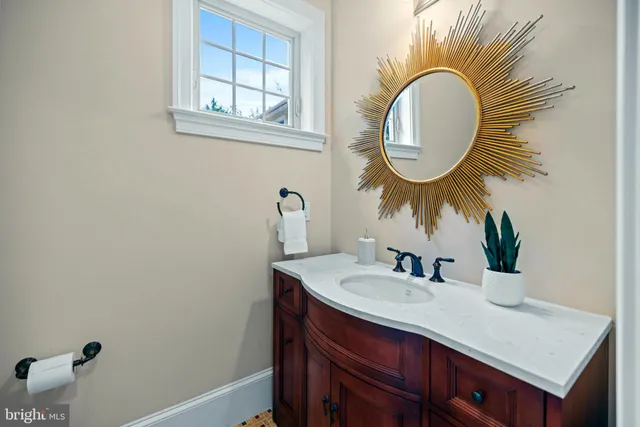 a bathroom with a sink and a mirror