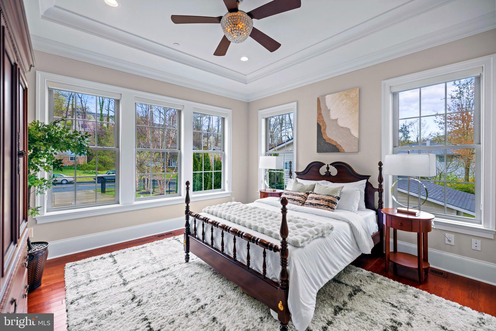 7708 Beech Tree Road Bethesda, MD 20817 - Photo 21 of 55 a bedroom with a bed and a large window with outer view