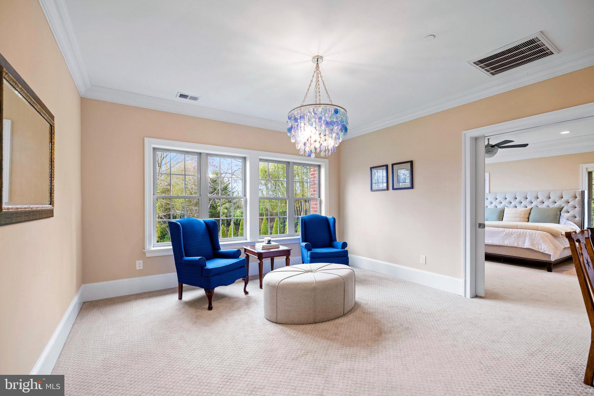 7708 Beech Tree Road Bethesda, MD 20817 - Photo 29 of 55 a living room with furniture and a chandelier