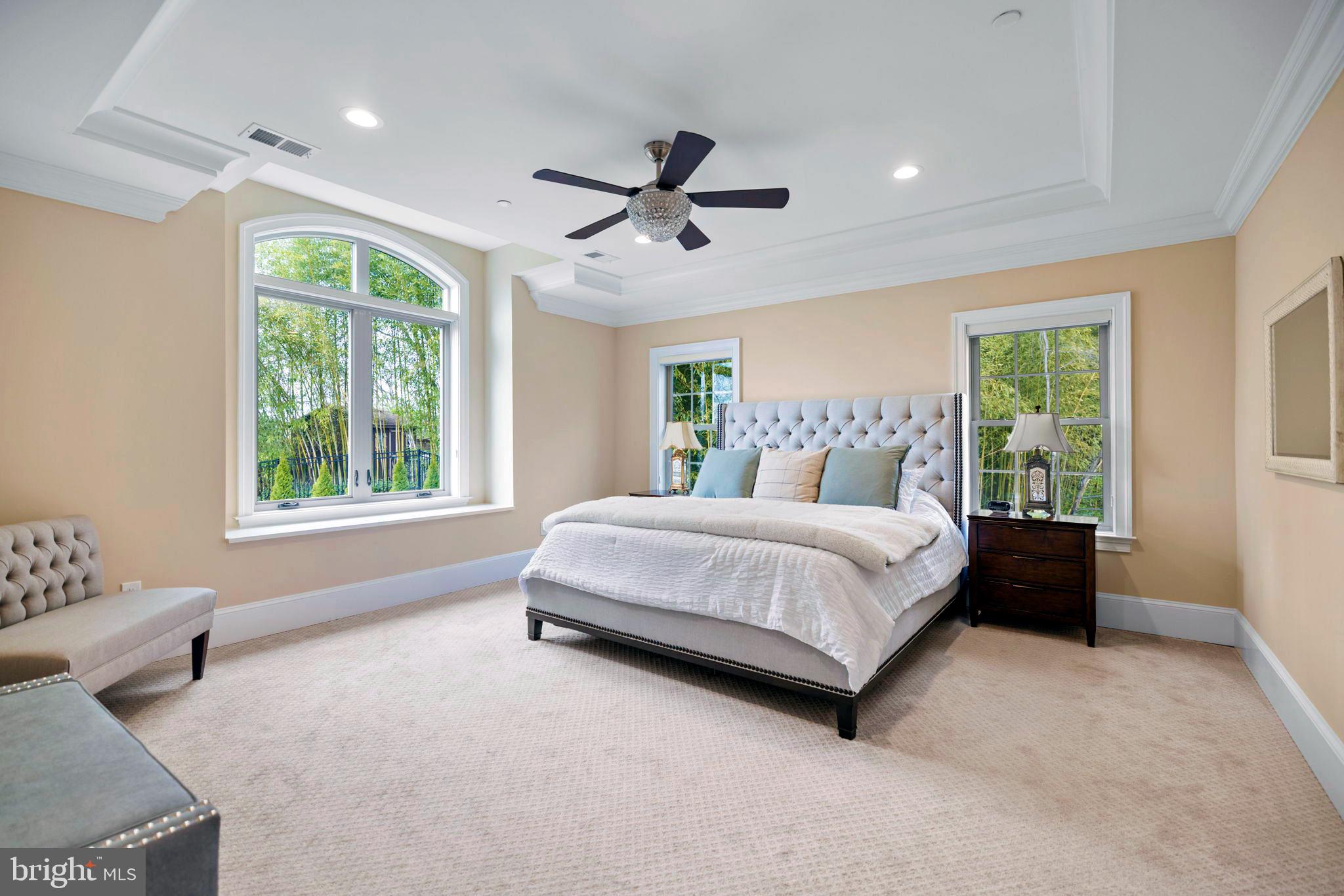 7708 Beech Tree Road Bethesda, MD 20817 - Photo 31 of 55 a spacious bedroom with a large bed and a window