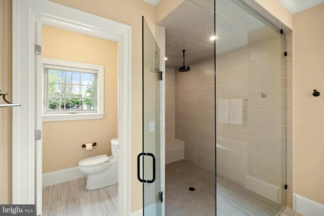 a large bathroom with a large tub sink and window