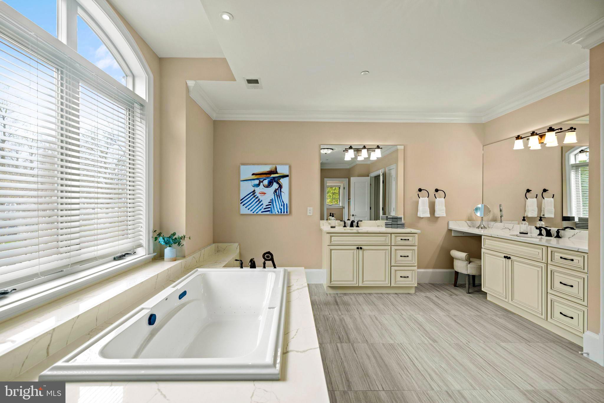 7708 Beech Tree Road Bethesda, MD 20817 - Photo 37 of 55 a large bathroom with a large tub sink and window