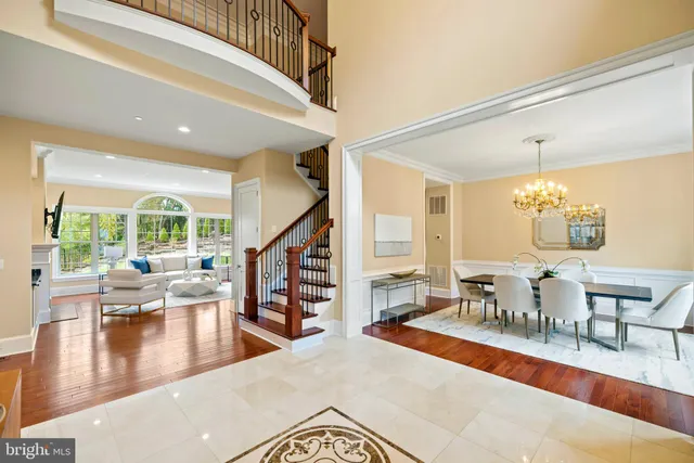a living room with lots of furniture and a large window