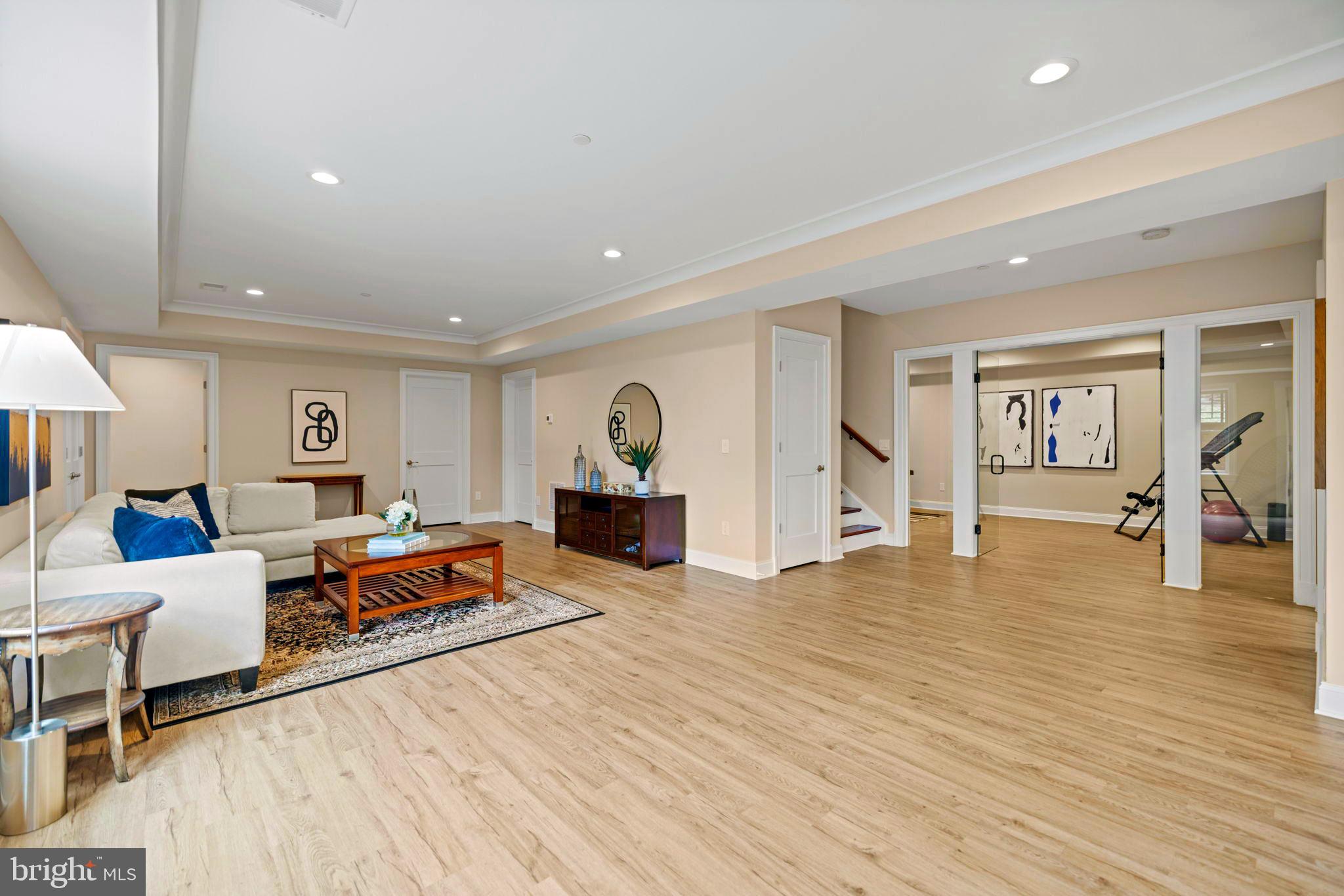 7708 Beech Tree Road Bethesda, MD 20817 - Photo 45 of 55 a living room with furniture and a wooden floor