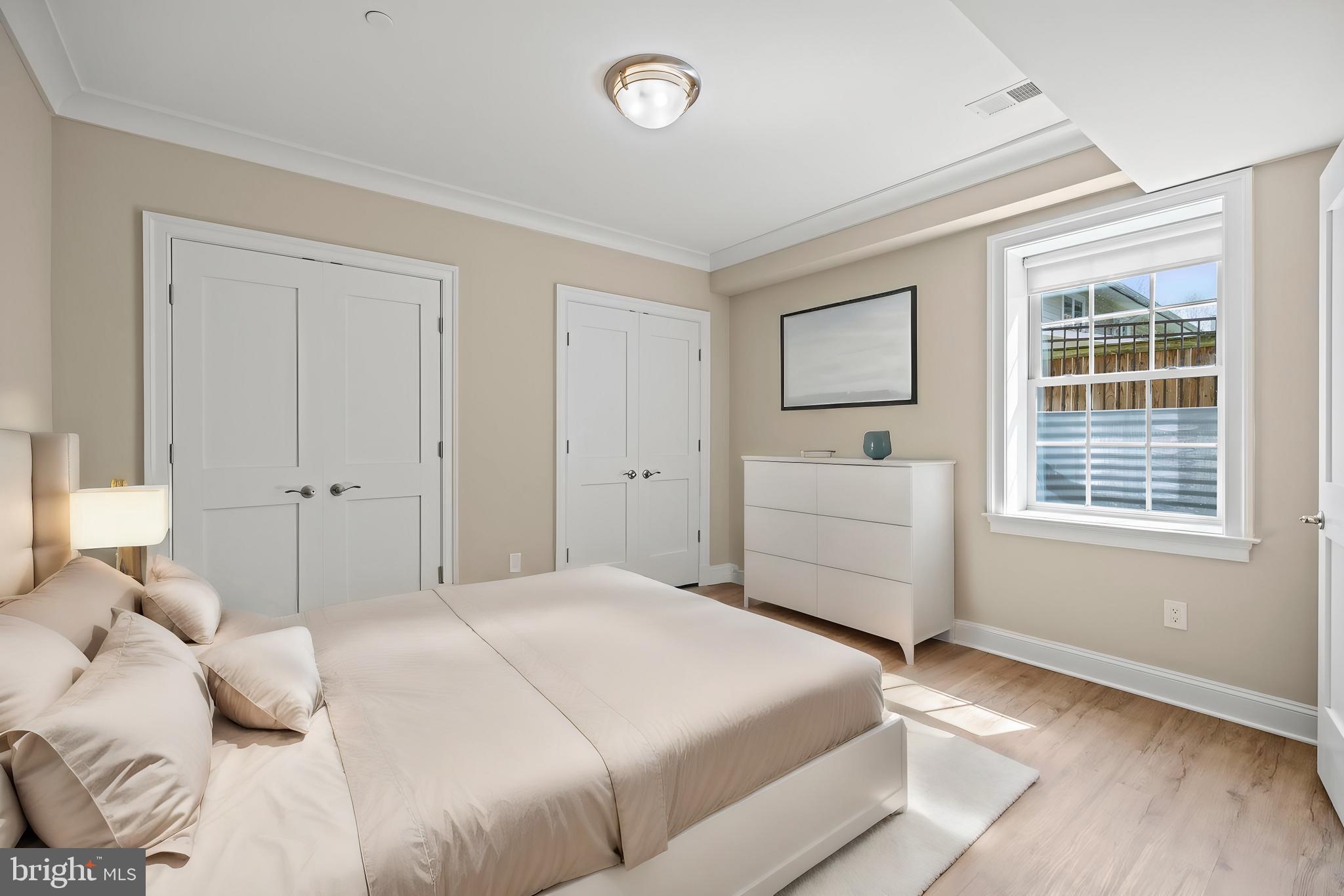 7708 Beech Tree Road Bethesda, MD 20817 - Photo 49 of 55 a bedroom with a bed and a window